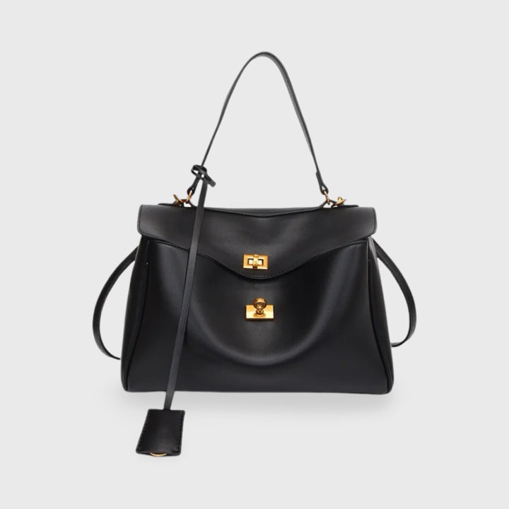 Front view of the Ciara vegan leather shoulder bag in black with gold hardware and shoulder strap