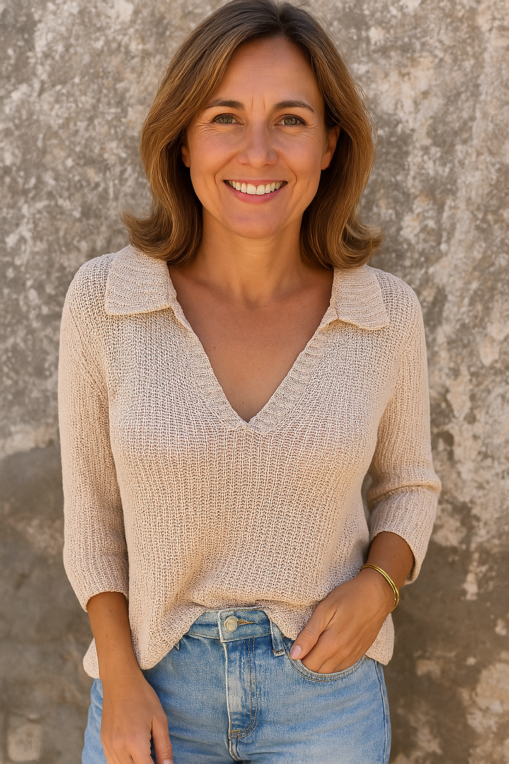 Front view worn by model, a smiling woman in a beige Lina V-neck top and light blue jeans