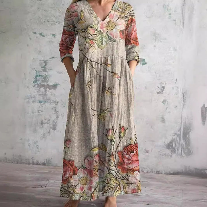 Front view of a model wearing a lightweight boho floral V-neck summer dress with pockets