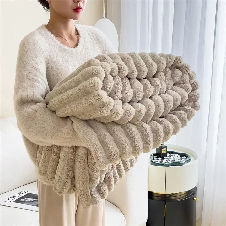 Ultra-Soft Faux Rabbit Velvet Blanket, worn by model, folded and held up, showing ribbed texture