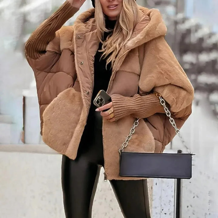 Vera Faux Fur Hooded Winter Parka, front view worn by model, with black top, beanie, and leather look pants