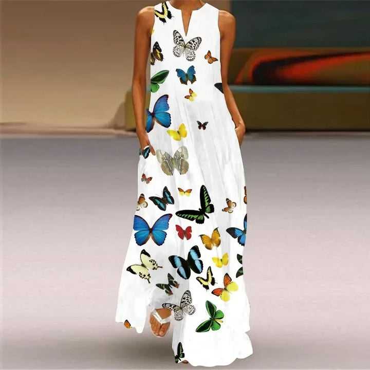 Front view of a model wearing the Butterfly Bloom A-Line Dress with a colourful butterfly print and pockets