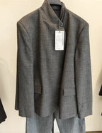 Front view of a charcoal grey mandarin collar jacket with a single button closure and front patch pockets