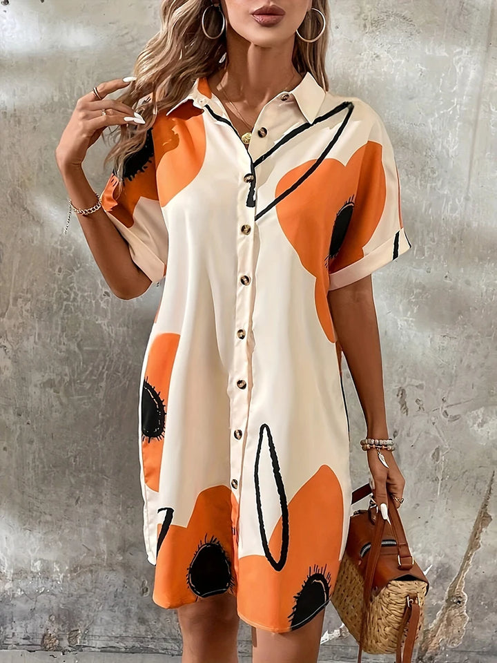 Cream, orange and black abstract print shirt dress, front view