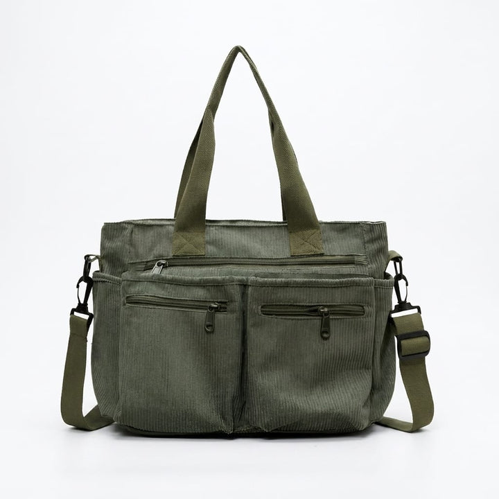 Front view of the olive green Urban Cord Tote Bag with multiple external zippered pockets and adjustable shoulder strap