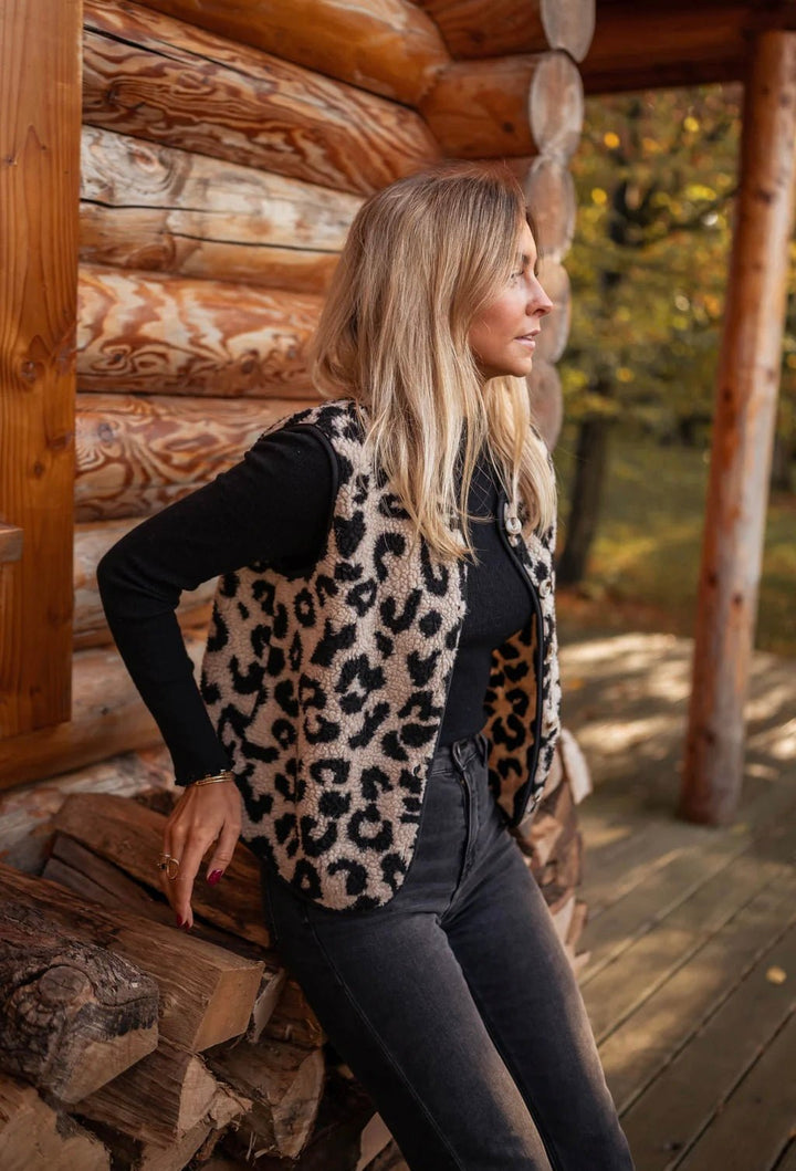 Beige and black leopard knitted vest with a black long sleeve top