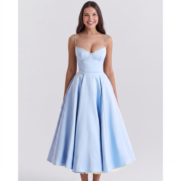 Front view worn by model, a light blue satin corset dress with delicate spaghetti straps and a full midi skirt