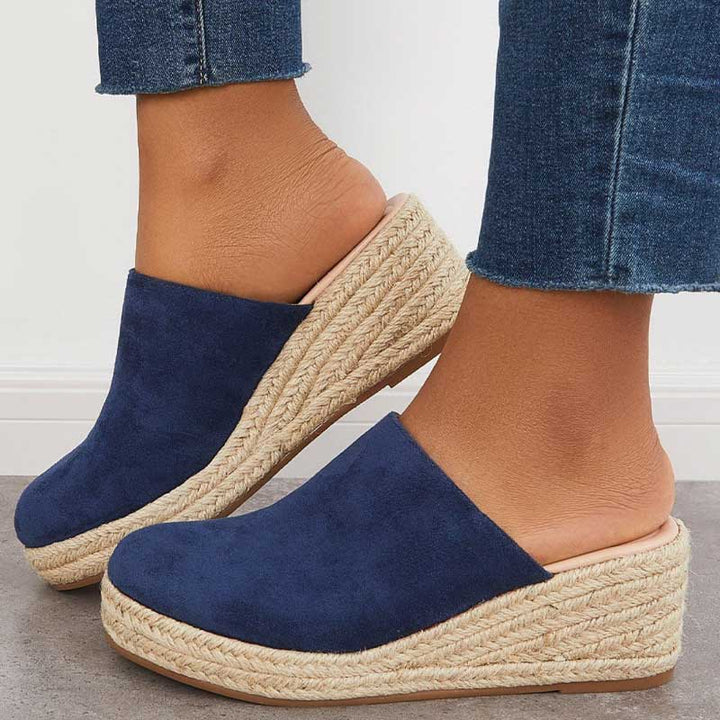 Wendy Platform Sandals worn by model, a pair of navy blue comfort heel sandals with espadrille wedge soles