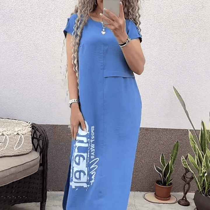 Front view of a model wearing a blue casual summer t-shirt dress with a white graphic print and side split