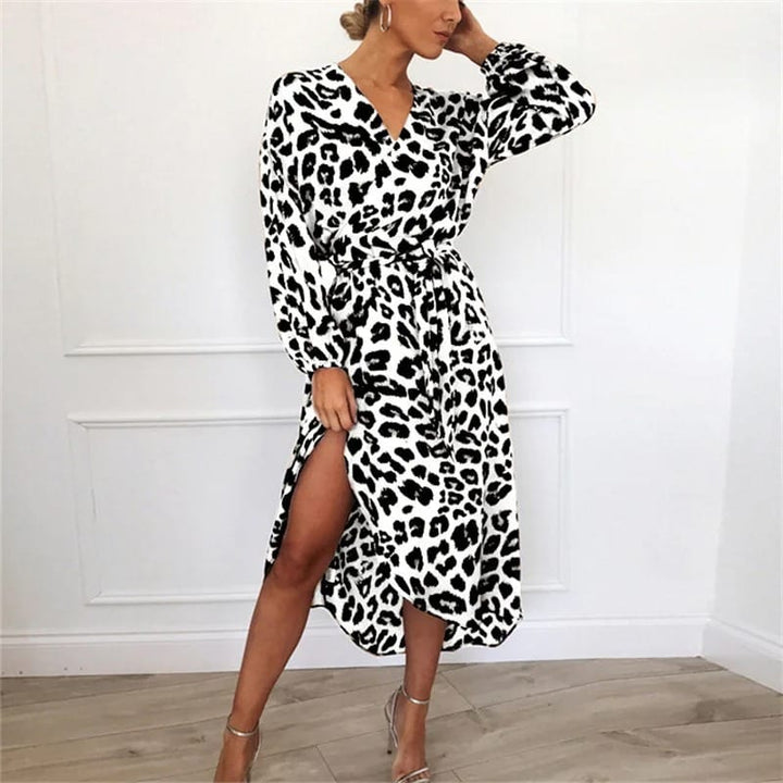 Front view, model wearing a leopard print high-waist chiffon dress with a thigh-high split and long sleeves
